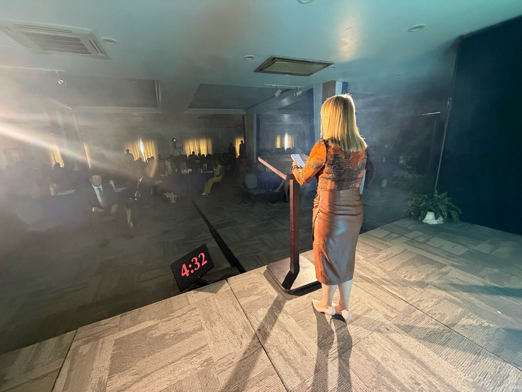 Kimberlee speaking to an audience