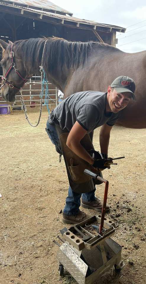 Dustyn working beneath a horse